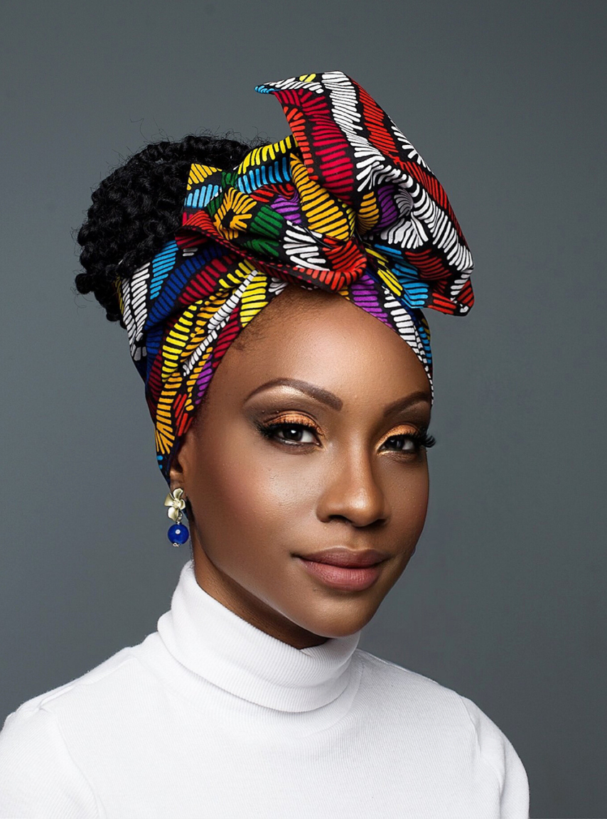 The colorfully wire headwrap features vibrant hues of red, blue, green, and yellow, creating a stunning rainbow effect.